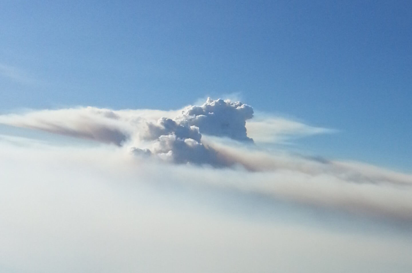 Smoke plume above clouds, Indi Range