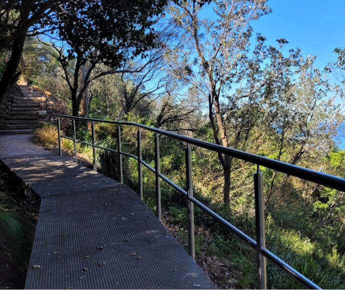 Glimpse of horizon where ocean meets sky, through trees high up on the Bald Hill Track; part of the Great Southern Walk through the Illawarra Escarpment State Conservation Area