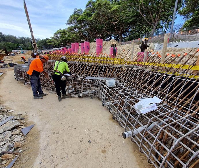 Construction of the capping beam at Nielsen Park, Sydney Harbour National Park, showing reinforced concrete structures and construction materials on-site.
