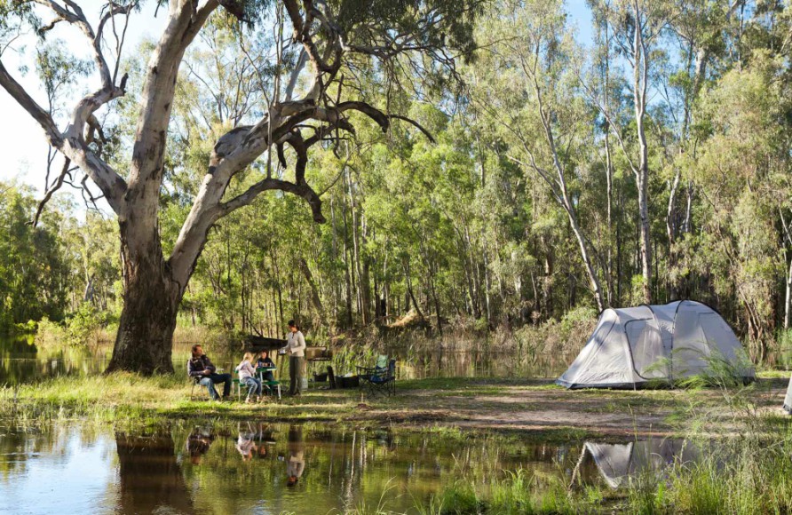 A couple are camping by the river in the Murray Valley National Park